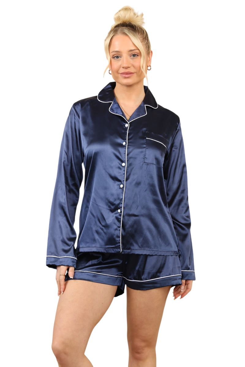 Model in navy blue satin pyjama set featuring long sleeves and shorts, showcasing luxury loungewear that is silky, soft, and machine washable.