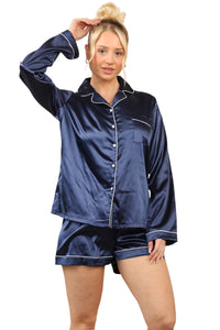 Model in navy blue satin pyjama set featuring long sleeves and shorts, showcasing luxury loungewear that is silky, soft, and machine washable.