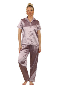 Model wearing a mauve satin two-piece pyjama set with short-sleeve top, collar, and full-length trousers with pockets