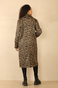 long line leopard print coat with button closure, large front pockets, and a back slit.